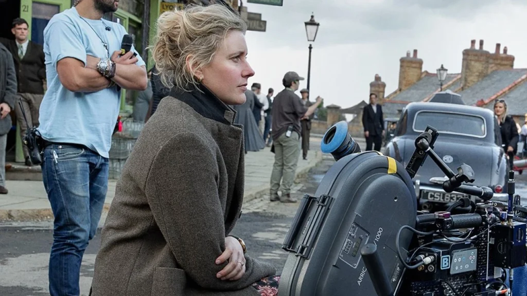 The Chronicles of Narnia: The Sorcerer’s Nephew logo and Greta Gerwig on the film set
