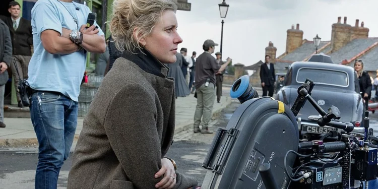 The Chronicles of Narnia: The Sorcerer’s Nephew logo and Greta Gerwig on the film set The Chronicles of Narnia: The Sorcerer’s Nephew logo and Greta Gerwig on the film set